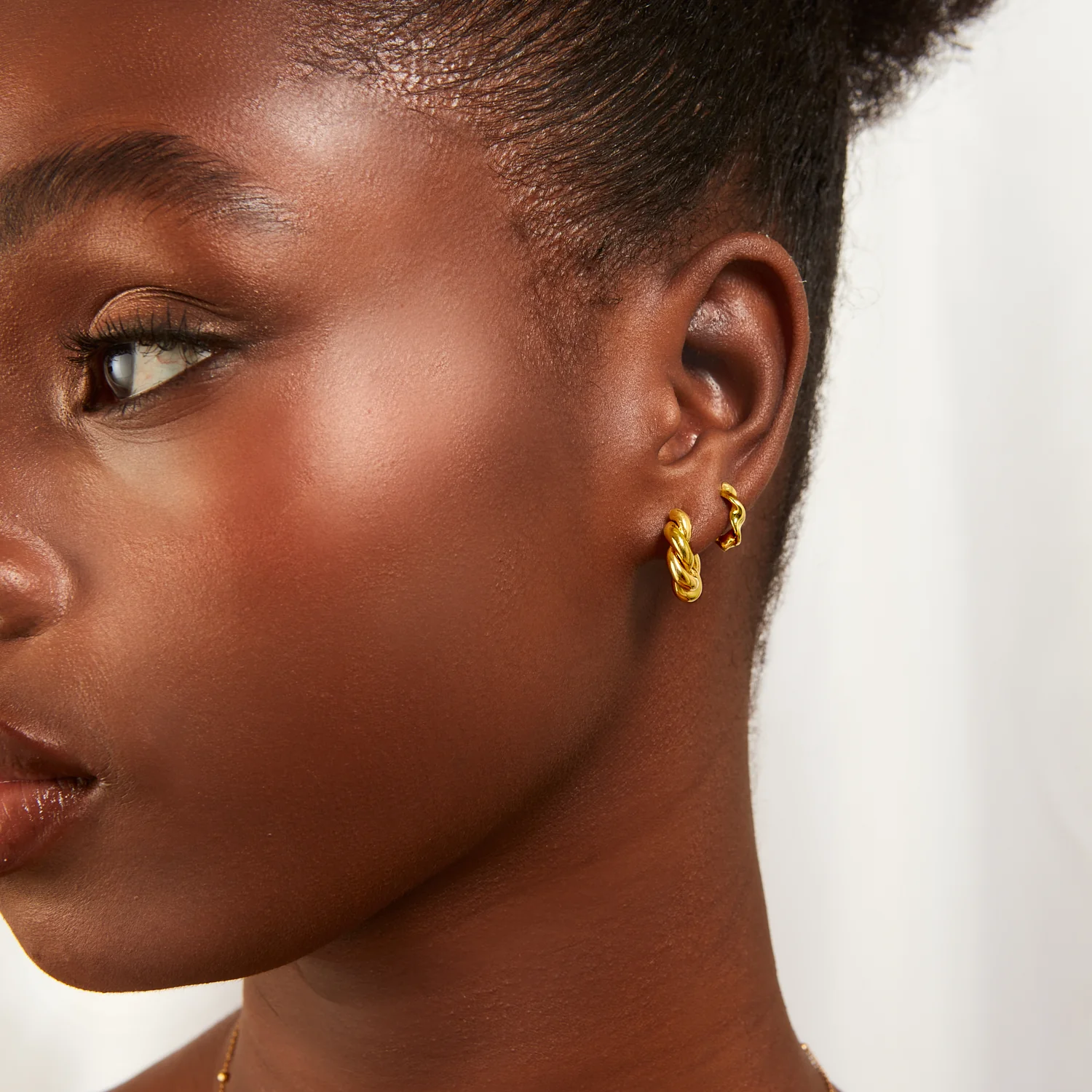 Twisted Huggie Hoop Earrings (Gold) - Image 3